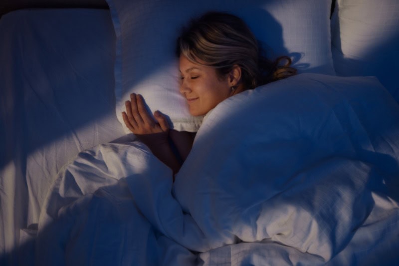 woman sleeping in her bed.