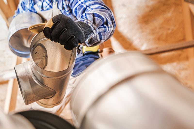 Leaky Ducts and You - Man Fixing Ducts.